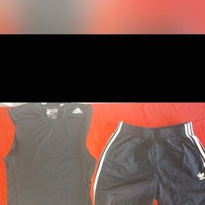 Women's Adidas top size medium. Women's Adidas shorts size medium/small.